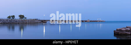 A panoramic shot of the Suncor Pier (Petro Canada Pier) at dusk in Oakville, Ontario, Canada. Stock Photo