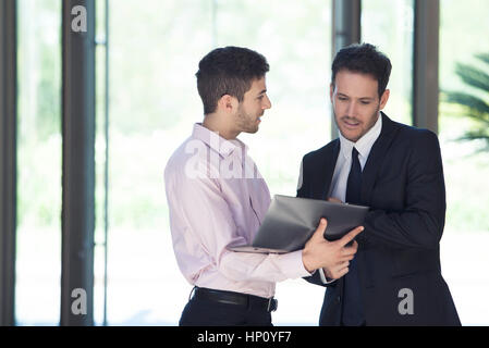 Businessman sharing idea with associate Stock Photo