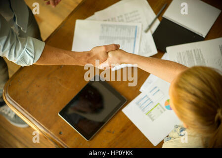 Business associates shaking hands during meeting Stock Photo