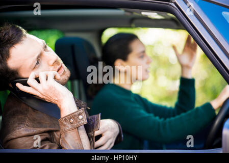 Couple stuck in traffic Stock Photo