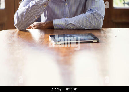 Businessman using digital tablet for video conference Stock Photo