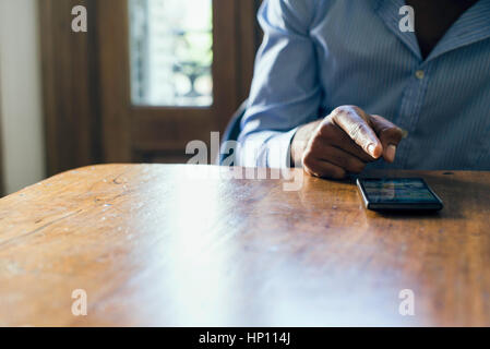Using smartphone with touchscreen Stock Photo