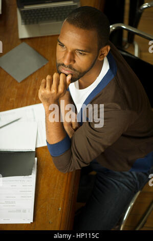 Businessman listening attentively during meeting Stock Photo