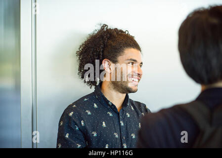 Man chatting with friends Stock Photo