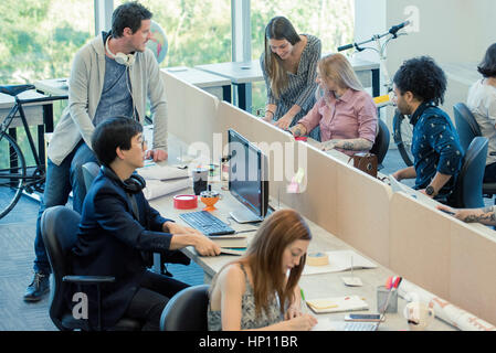Colleagues working together in casual office Stock Photo