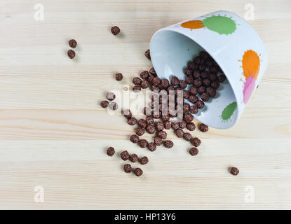 Cereal chocolate balls and glass of milk on breakfast Stock Photo