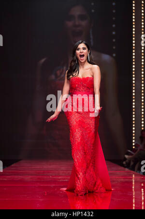 New York, NY USA - February 9, 2017: Diane Guerrero in Gustavo Cadile walks runway for the Red Dress Collection 2017 fashion show by Macys at Hammerstein Ballroom at Manhattan Center benefit American Heart Association Stock Photo