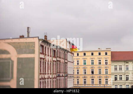 A German flag flies from the roof of an apartment building in Frankfurt (Oder) ahead of a right-wing protest Stock Photo