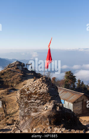 Hindu holy site on the path to Pathibhara Devi Temple with view over the Himalayan foothills, Taplejung, Nepal Stock Photo