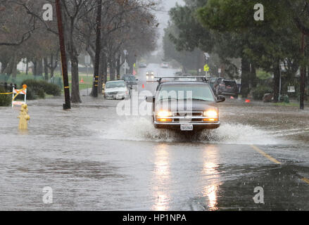 Santa Barbara, California, USA. 17th February, 2017. A car drives through the flooded intersection of East Cota and Salsipuedes in Santa Barbara, California, Heavy rains and strong winds drenched the central coast Friday, February 17, 2017. Credit: Daniel Dreifuss/Alamy Live News Stock Photo