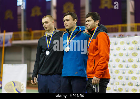 Sumy, Ukraine. 17th February, 2017. Malykhin Vladyslav (gold), Eryomin Ivan(silver) and Mandych Vladyslav (bronze) are winners in pole vault competition in Ukrainian indoor track and field championship. Credit: Sergii Kumer/Alamy Live News Stock Photo