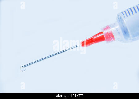 Injection needle closes up Stock Photo