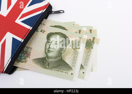 Union Jack coin purse with Chinese 1 Yuan banknotes - as metaphor for Yuan / Renminbi-Sterling exchange rate. Stock Photo