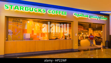 DUBAI, UNITED ARAB EMIRATES - Starbucks Coffee shop in shopping mall, with bilingual sign in english and arabic. Stock Photo