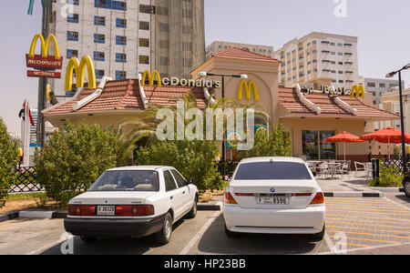 SHARJAH, UNITED ARAB EMIRATES - MacDonald's fast food restaurant with sign in arabic. Sharjah city is 10km northeast of Dubai. Stock Photo