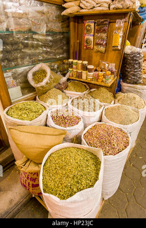 DUBAI, UNITED ARAB EMIRATES - Bags of spices on display in spice market. Stock Photo