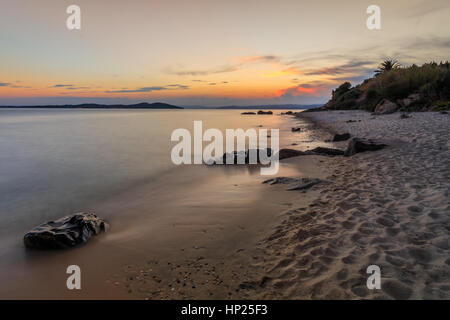 sunset on the beach near Ouranoupolis city. Halkidiki, Greece Stock Photo