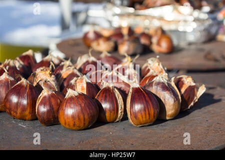 Delicious roasting chestnuts on pan for sale at streets of Sofia, Bulgaria Stock Photo