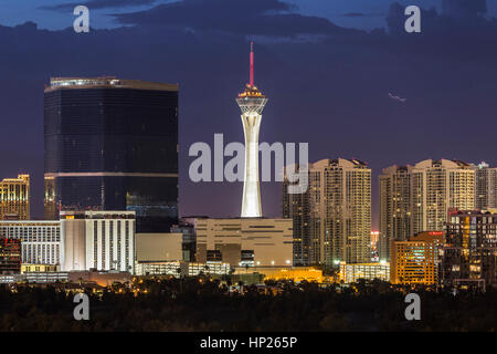 Las Vegas, Nevada, USA - June 10, 2015:  Stormy night sky behind the Stratosphere and Fontainebleau towers on the Las Vegas Strip. Stock Photo