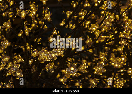 Background of decorative flower-shaped lights, full frame Stock Photo