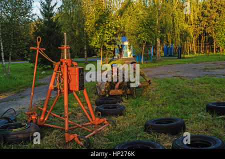 The jet fighter SU-27 is set by a monument in the territory of the Vitebsk aeroclub. Assembly of the SU-27 plane - installation of wings. Stock Photo