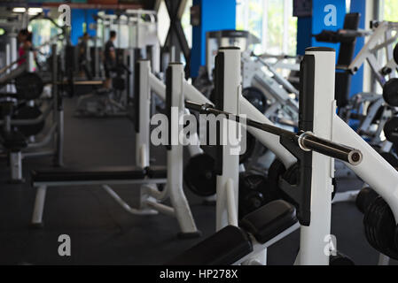 Gym with big windows and heavy weight equipment. Modern fitness bright club Stock Photo