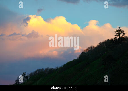 Sunset sky above the mountain slope, Sakhalin, Russia Stock Photo