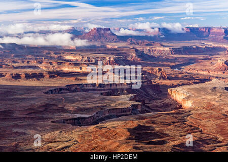 Morning fog burning off in Soda Springs Basin, seen from the Green River Overlook in Canyonlands National Park, Utah Stock Photo