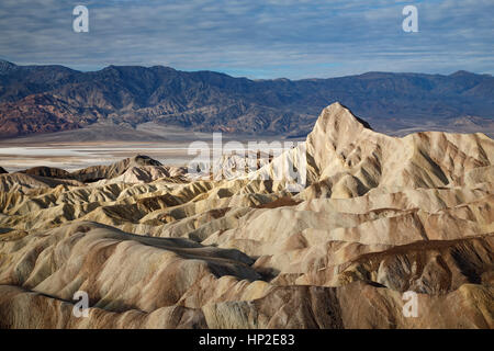 Manley Beacon, badlands and Panamint Range, Zabriskie Point,  Death Valley National Park, California USA Stock Photo