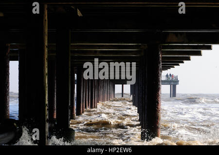 Supports under the pier at Southwold in choppy sea's in the winter Stock Photo