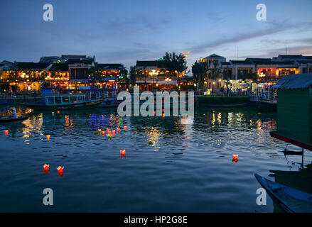 Candle lanterns float on the Thu Bon River for the full moon festival, Hoi An, Vietnam Stock Photo