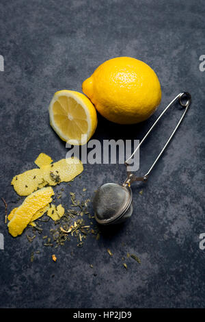 Green tea with lemon zest, black background Stock Photo