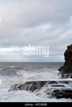 Waves breaking against the rocks at Souter Beach, National Trust ...