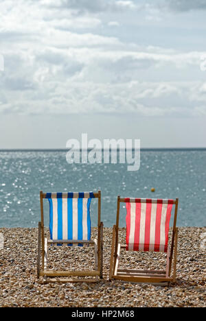 Two Empty Deck Chairs on a Beach
