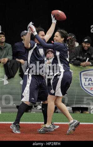 Martin Gramatica, left, celebrates his touch down with Susie Castillo at the Tazon Latino V flag football game at Super Bowl NFL Experience at the Dallas Convention Center on February 2, 2011 in Dallas, Texas. Photo by Francis Specker Stock Photo