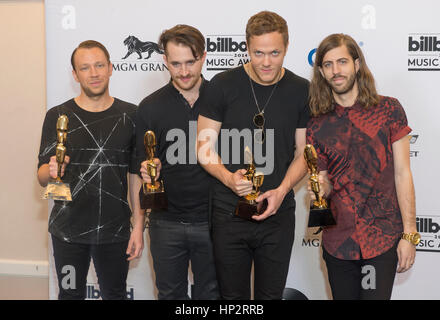 Members of the alternative rock band Imagine Dragons attend the 2014 Billboard Music Awards press room at the MGM Grand Garden Arena in Las Vegas. Stock Photo