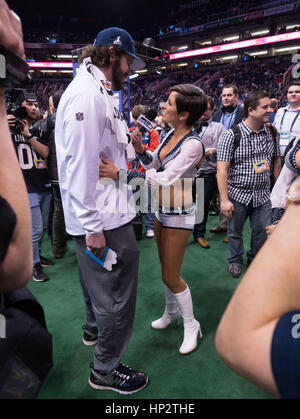 Patriots Danny Aiken, left, is dances with a Seattle Seahawks cheerleader on Super Bowl Media Day on January 27, 2015 in Phoenix, Arizona. Photo by Francis Specker Stock Photo