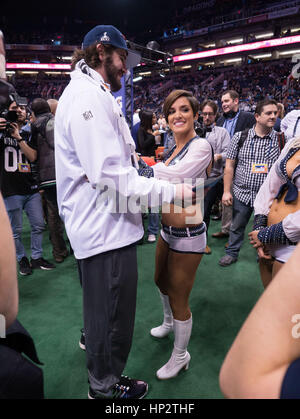 Patriots Danny Aiken, left, is dances with a Seattle Seahawks cheerleader on Super Bowl Media Day on January 27, 2015 in Phoenix, Arizona. Photo by Francis Specker Stock Photo