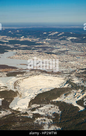 Quarry for extraction and production of talc and various types of rubble in vicinity of Miass city in winter, aerial view Stock Photo