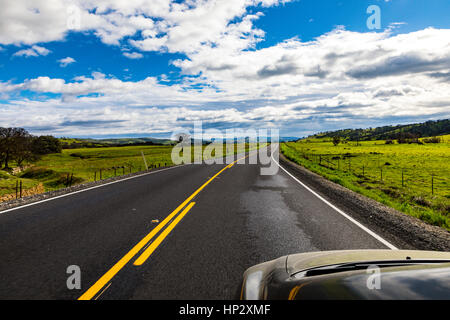 Driving along Yosemite Boulevard California Highway 132 in the Sierra Nevada Foothills of California in the winter of 2017 Stock Photo