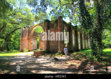 The Sheldon Church ruins at Yemassee, South Carolina are framed by Live Oak trees and Spanish moss in this landscape photo. The ruins are dramatic. Stock Photo