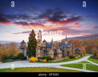 The picturesque sunset and cumulus clouds over the ancient castl Stock Photo