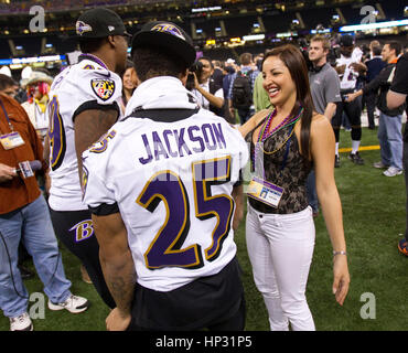 Johanna Pena Gutierrez a reporter with TV Azteca Noreste, right, interviews Baltimore Ravens' Asa Jackson, (25), and D.J. Bryant at the Super Bowl XLVII Media Day on January 29, 2013, in New Orleans, Louisiana. Photo by Francis Specker Stock Photo