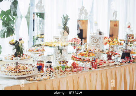 Banquet table full of fruits and berries an assortment Stock Photo