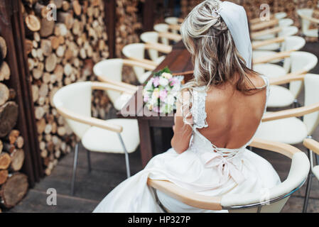 Portrait of gorgeous bride with a wedding bouquet Stock Photo