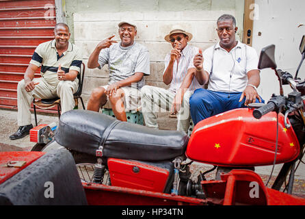 Friends greeting, in Consulado street, Centro Habana district, La Habana, Cuba Stock Photo
