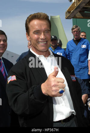 California Gov. Arnold Schwarzenegger gives a thumbs up after giving a speech on California's woker's compensation system at Ace Clearwater Enterprises, a metal fabrication facility,  in Torrance, California on Friday 19 March, 2004. Schwarzenegger plans to gather signatures for a ballot initiative if he can't work out a agreement with the state's legislature. Photo by Francis Specker Stock Photo