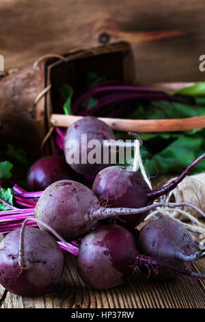 Bunch of fresh organic beetroots on wooden rustic table Stock Photo