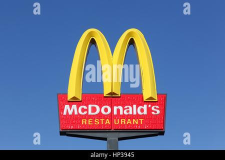 Horsens, Denmark - September 30, 2015: McDonald's logo on a pole. McDonald's is the world's largest chain of hamburger fast food restaurants Stock Photo