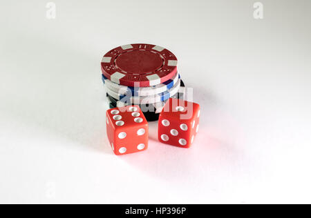 Gambling chips and dice on a white background Stock Photo
